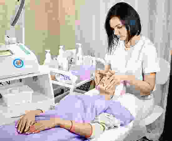 blog-detail-10 A woman is giving an elderly man a manicure.